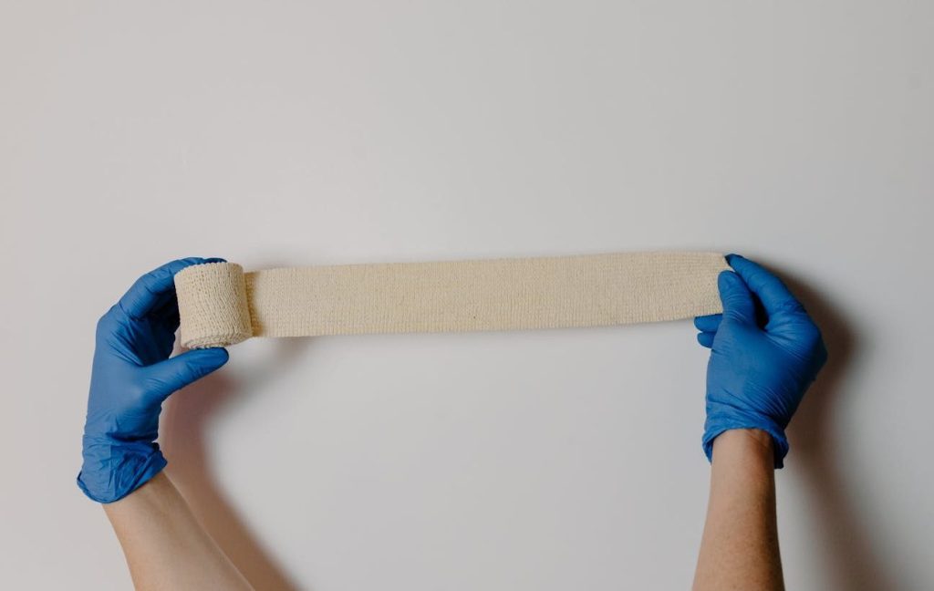 a person holding a gauze tape